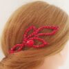 Ballroom hair piece with red crystals