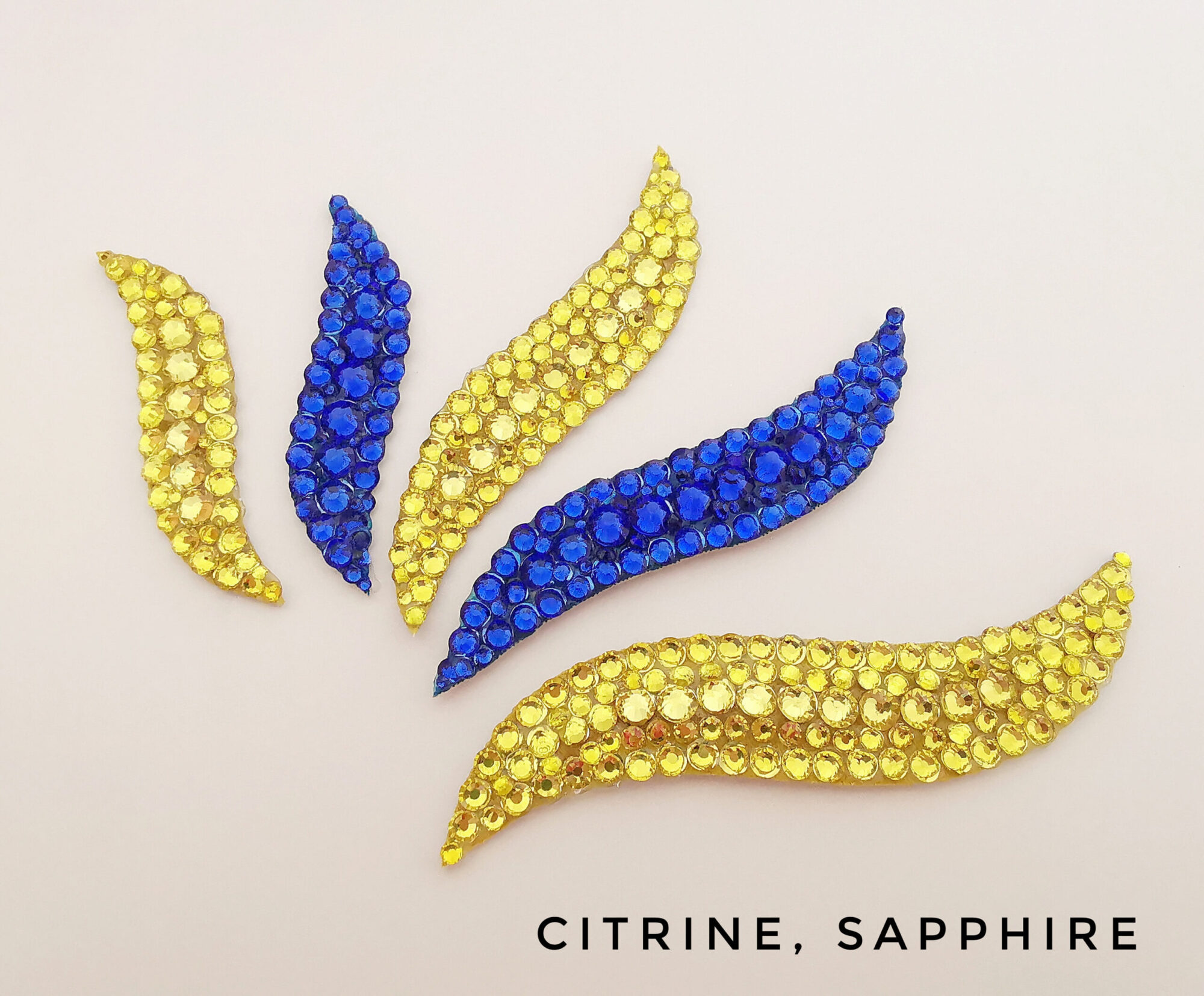 Ballroom hairpiece with yellow and blue rhinestones