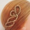 Ballroom hair piece with golden crystals
